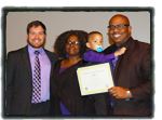 Adoptive Parents with Child and Certificate